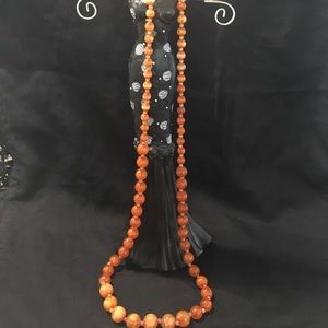 Orange beaded necklace.